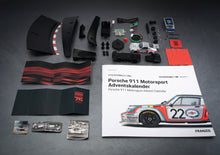 Load image into Gallery viewer, FRANZIS Porsche 911 Motorsport Advent Calendar - Carrera RSR Turbo 2.1 1:43 Model Kit with Engine Sound Base, A2 Poster & 52-Page Book