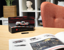 Load image into Gallery viewer, FRANZIS Porsche 911 Motorsport Advent Calendar - Carrera RSR Turbo 2.1 1:43 Model Kit with Engine Sound Base, A2 Poster & 52-Page Book