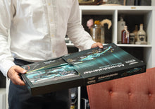 Load image into Gallery viewer, FRANZIS Aston Martin Aramco F1 Advent Calendar — AMR25 1:43 Model Kit with Engine Sound Base, A2 Poster & 52-Page Book