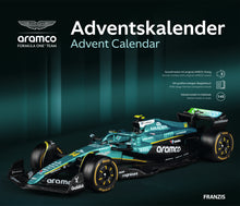 Load image into Gallery viewer, FRANZIS Aston Martin Aramco F1 Advent Calendar — AMR25 1:43 Model Kit with Engine Sound Base, A2 Poster &amp; 52-Page Book
