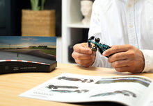 Load image into Gallery viewer, FRANZIS Aston Martin Aramco F1 Advent Calendar — AMR25 1:43 Model Kit with Engine Sound Base, A2 Poster &amp; 52-Page Book
