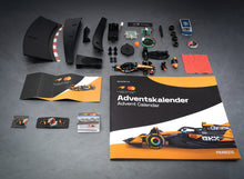 Load image into Gallery viewer, Franzis McLaren Racing Advent Calendar — MCL39 1:43 F1 Model Kit with Engine Sound Base, A2 Poster &amp; 52-Page Book
