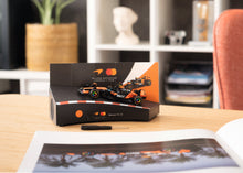 Load image into Gallery viewer, Franzis McLaren Racing Advent Calendar — MCL39 1:43 F1 Model Kit with Engine Sound Base, A2 Poster &amp; 52-Page Book
